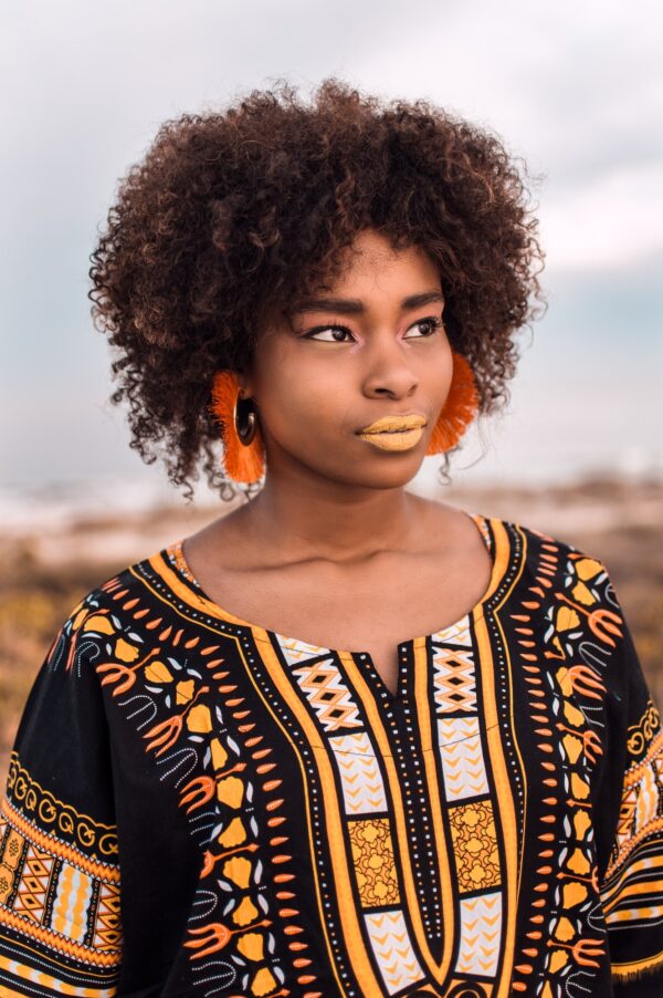 Young beautiful African woman, wearing African print design clothes